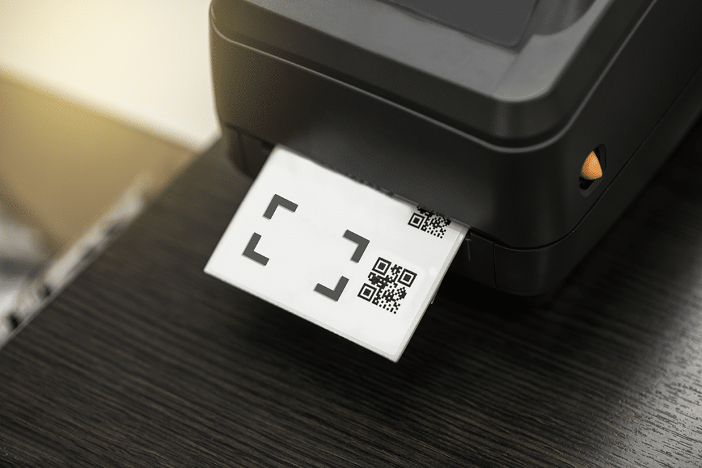 a barcode label being inserted into a printer